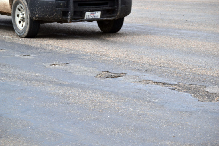 TxDOT needs drier weather to repair potholes on Dumas Avenue