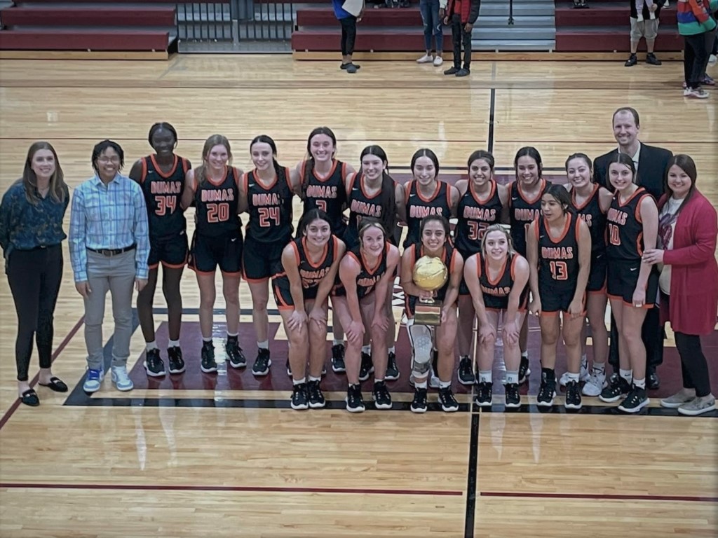 Photo of the Dumas Demonette Varsity basketball team after their Bi-District championship win over Lubbock Estacado. The team earned the first gold ball in six years for the girls varsity basketball program.
